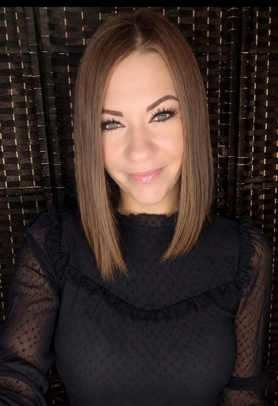 Lisa Everhart smiling in a black blouse